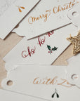 An example of modern calligraphy on Christmas gift tags, per the Lettering Guide: Christmas Gift Tags by Gemma Milly