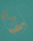 Detail shot of the gold foil on the cover of Tom's Studio A5 calligraphy practice pad