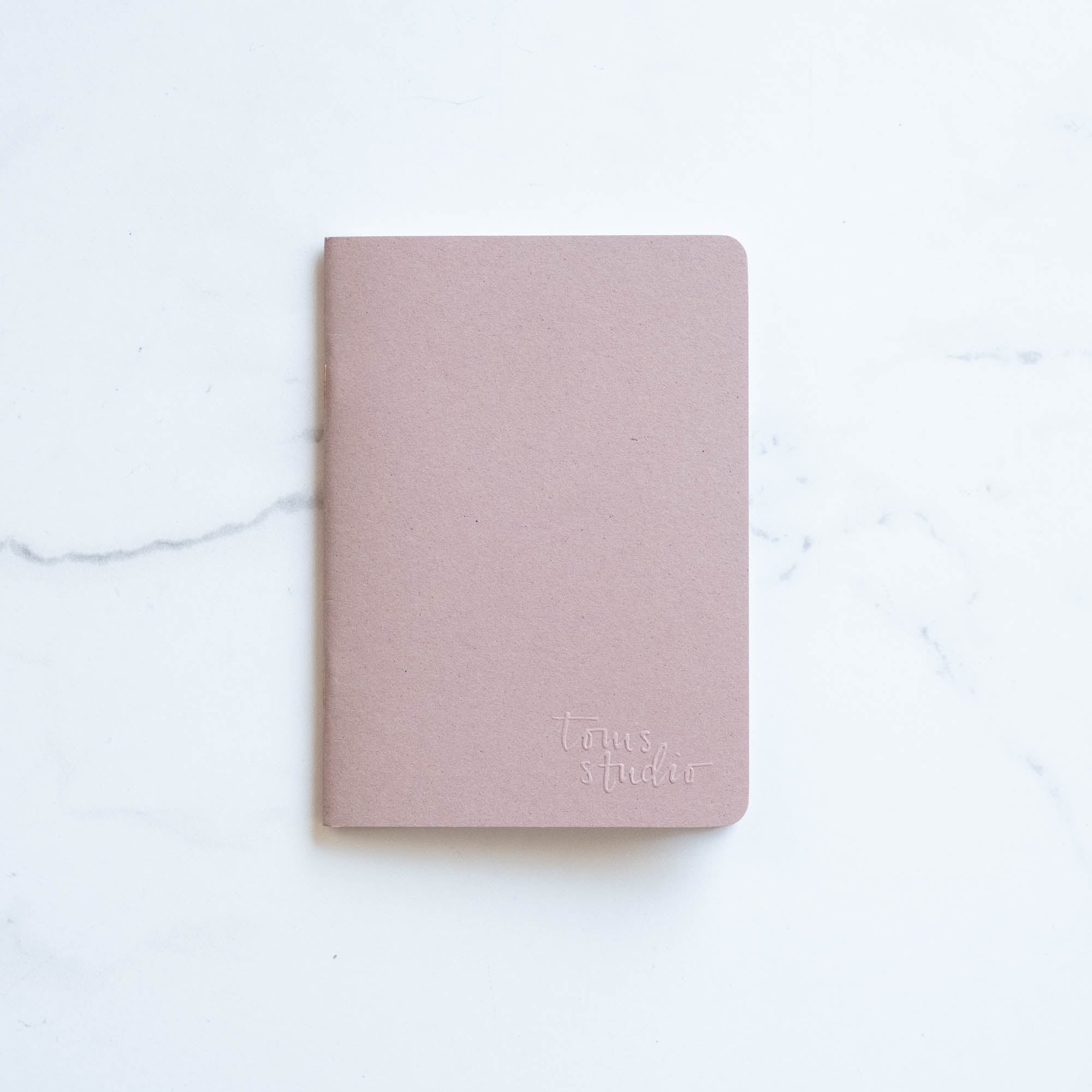 Tom's Studio x Coffeenotes A6 Notebook in Almond, made from recycled coffee cups and eco-friendly materials.