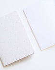 Tom's Studio x Coffeenotes A6 Notebook in 'Grounds' white, with plain pages, made from recycled coffee cups and eco-friendly materials.