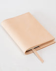 Handmade by Edward De Lacy: leather notebook / journal in natural. Closed cover.