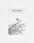 A pack of three Lumos 0.2mm fineliner replacement tips attached to a white backing card. The card features 'THE LUMOS REPLACEMENT TIPS' in uppercase black letters at the top, with an abstract black ink scribble design in the lower half. A black textured label in the upper right corner displays '0.2 Fineliner Tip' in white text.