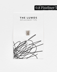 A pack of three Lumos 0.8mm fineliner replacement tips attached to a white backing card. The card features 'THE LUMOS REPLACEMENT TIPS' in uppercase black letters at the top, with an abstract black ink scribble design in the lower half. A black textured label in the upper right corner displays '0.8 Fineliner Tip' in white text.