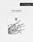 A pack of three Lumos 1.0mm fineliner replacement tips attached to a white backing card. The card features 'THE LUMOS REPLACEMENT TIPS' in uppercase black letters at the top, with an abstract black ink scribble design in the lower half. A black textured label in the upper right corner displays '1.0 Fineliner Tip' in white text.