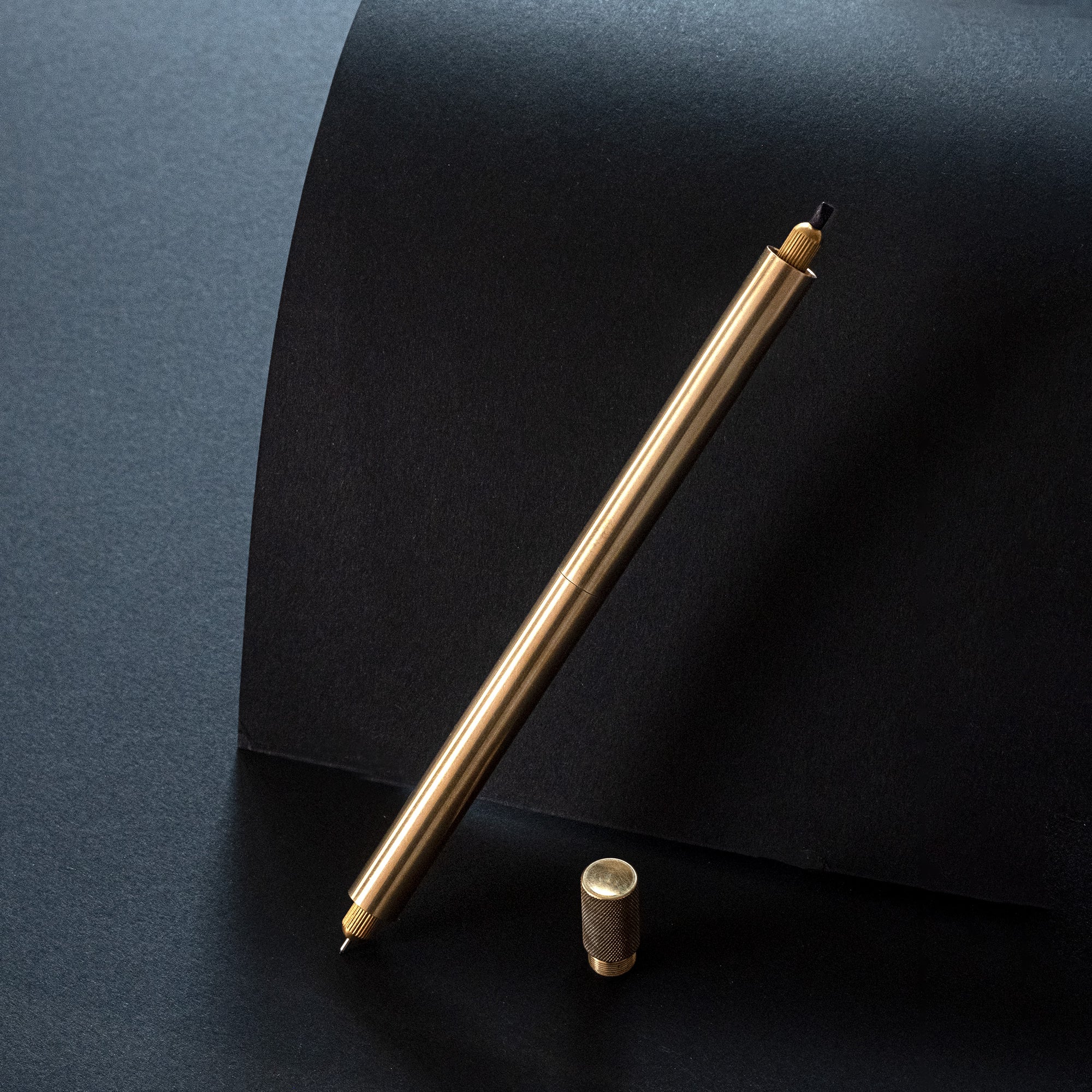 The Lumos Pro Duo refillable pen special edition in brass with knurled lid