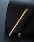 The Lumos Pro Duo refillable pen special edition in brass with knurled lid