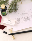 Contents of the Lumos Pro Duo Gift Set including: Lumos Pro Duo refillable pen in Black, 50ml bottle of Fountain Pen Ink in New Forest, the Studio Pad and Butterfly Brass Pen Rest