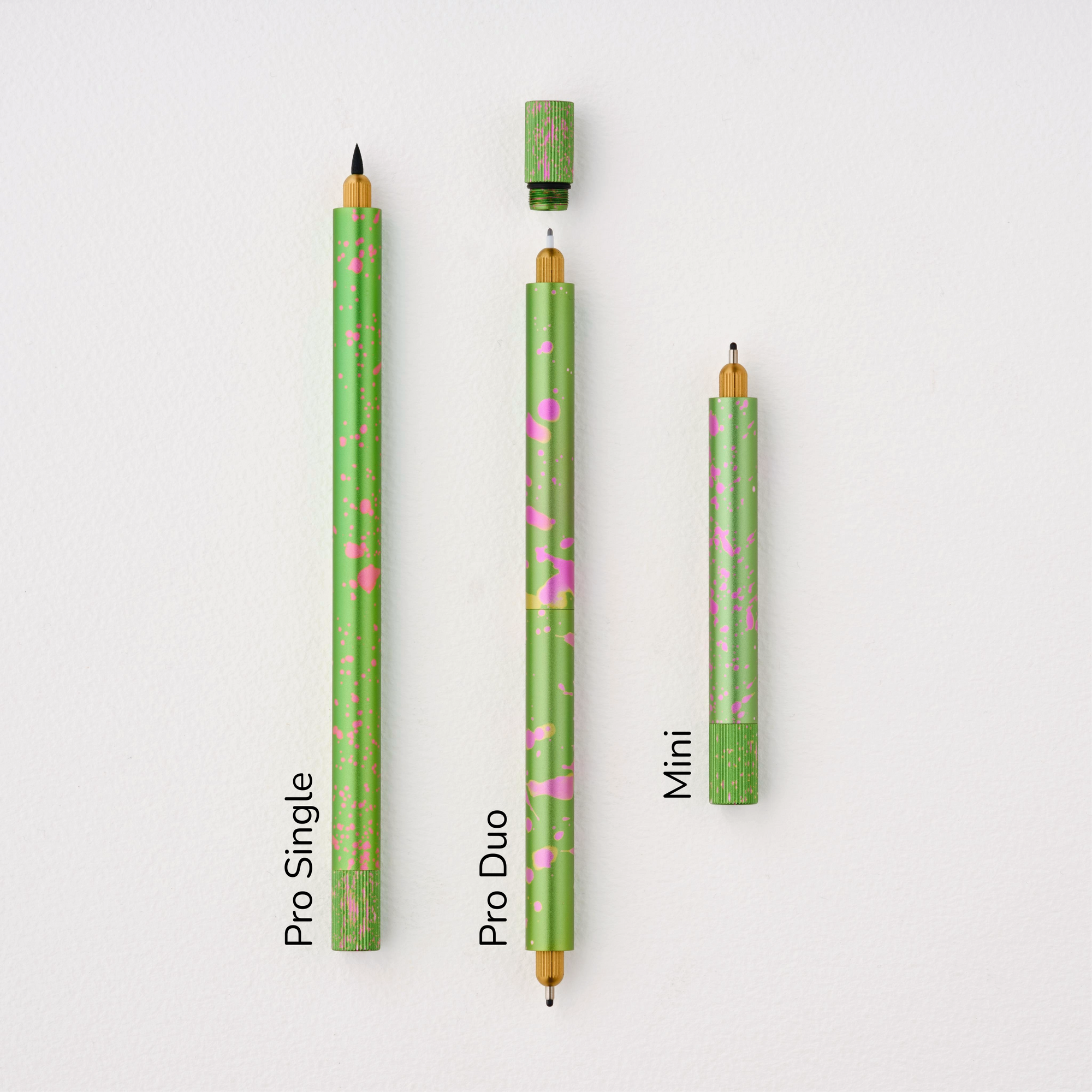 Lumos Splash Pro Single, Pro Duo, and Mini pens in Appletini green with pink splatter, shown uncapped on a white background with labels.