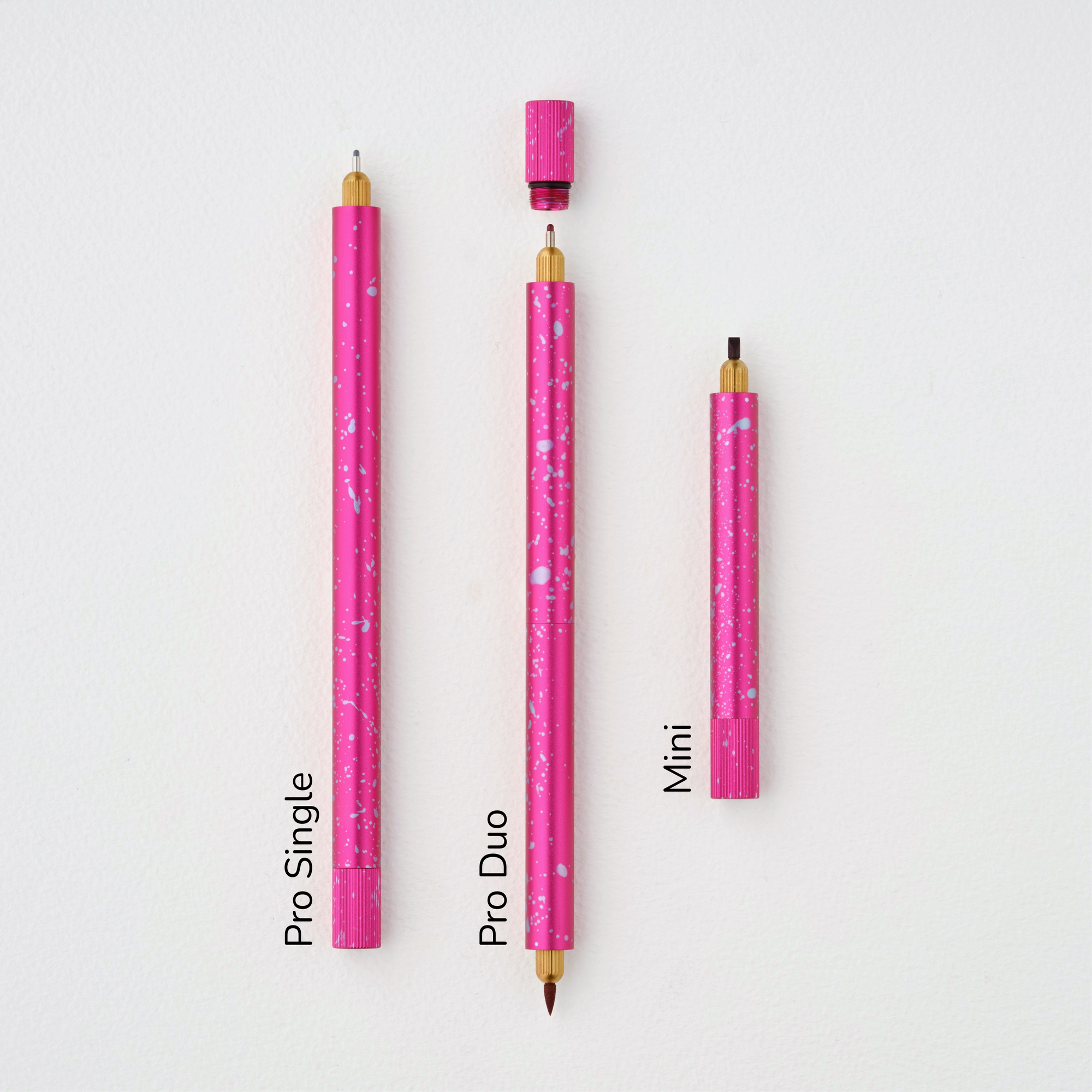 Lumos Splash Pro Single, Pro Duo, and Mini pens in Bubblegum pink with blue splatter, shown uncapped on a white background with labels.