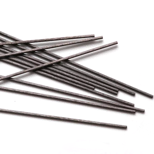 Close up image of the black mechanical pencil lead displayed on a white plain background.