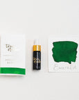 Tom's Studio Emerald Mini Fountain Pen Ink – featuring the packaging, bottle with pipette in lid and swatch
