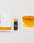 Tom's Studio Golden Lustre Mini Shimmer Fountain Pen Ink – featuring the packaging, bottle with pipette in lid and swatch