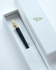 The One-Dip-Nib in Brass, shown in packaging