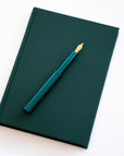 Semikolon A5 notebook in Forest green with a matching Studio Pocket Fountain Pen in Ivy green.