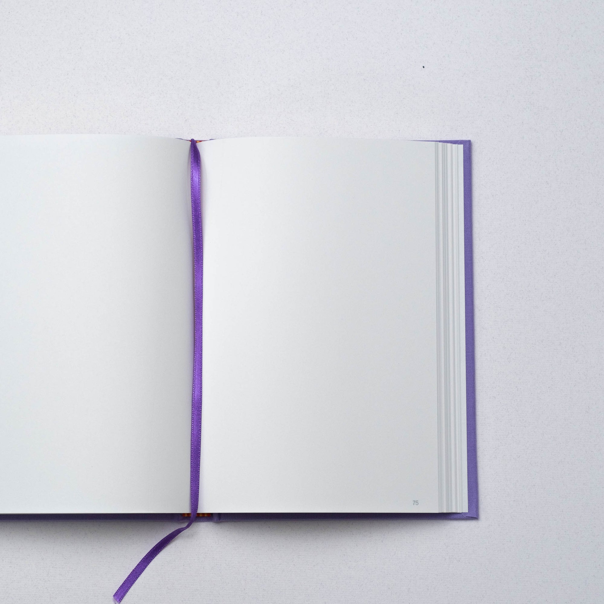 Semikolon A5 notebook in Lilac (purple) with plain pages, page marker ribbon and premium linen bound cover.