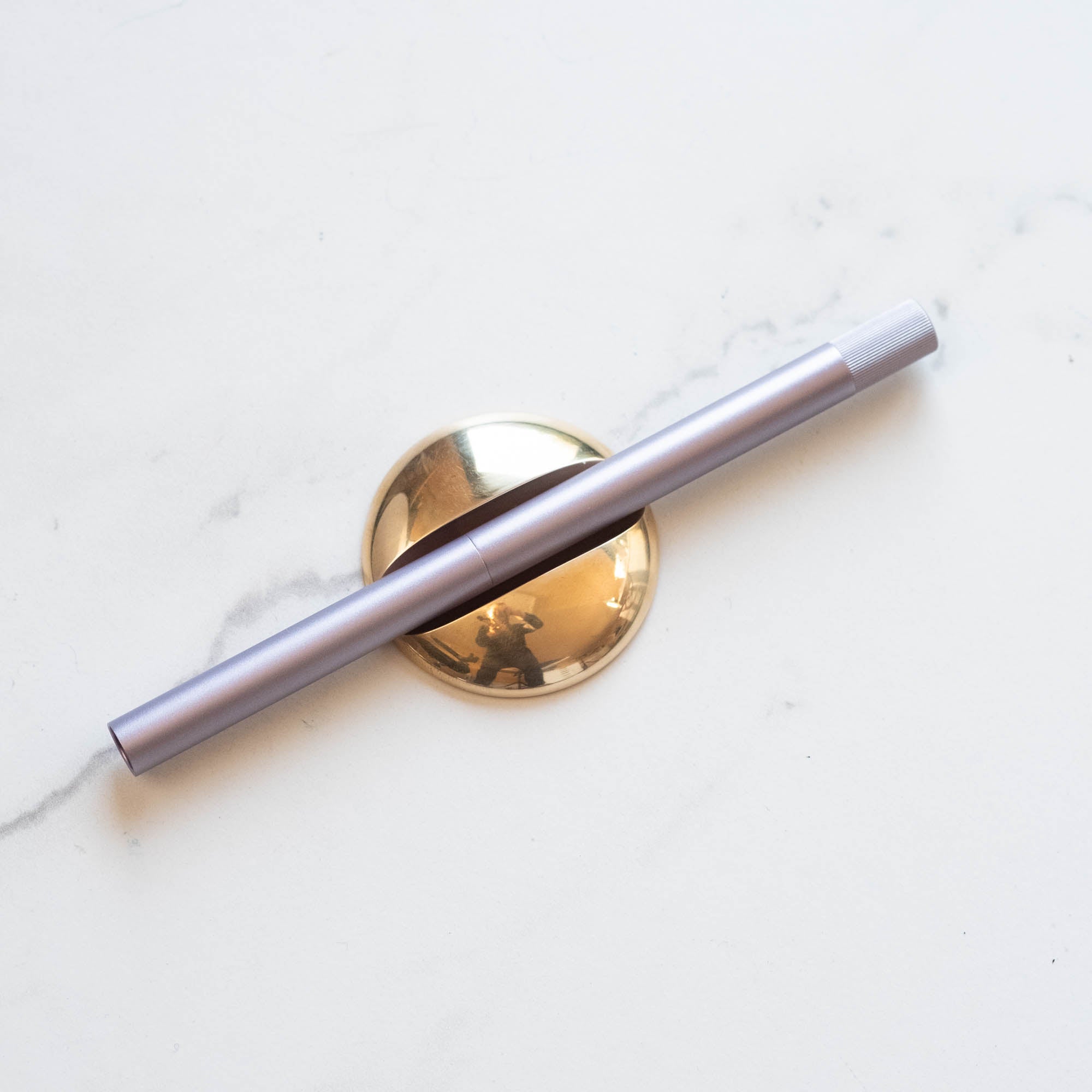 Solid Brass Pen Rest shown with Lumos Pro Duo pen in Lilac