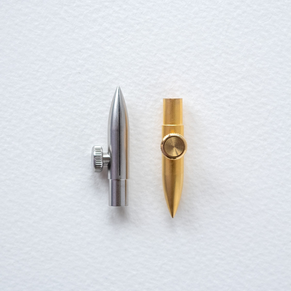 The One-Dip-Nib in Sterling Steel and Brass, shown side by side