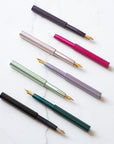 The Pocket Fountain Pen shown in various colours and with a selection of fountain pen nibs