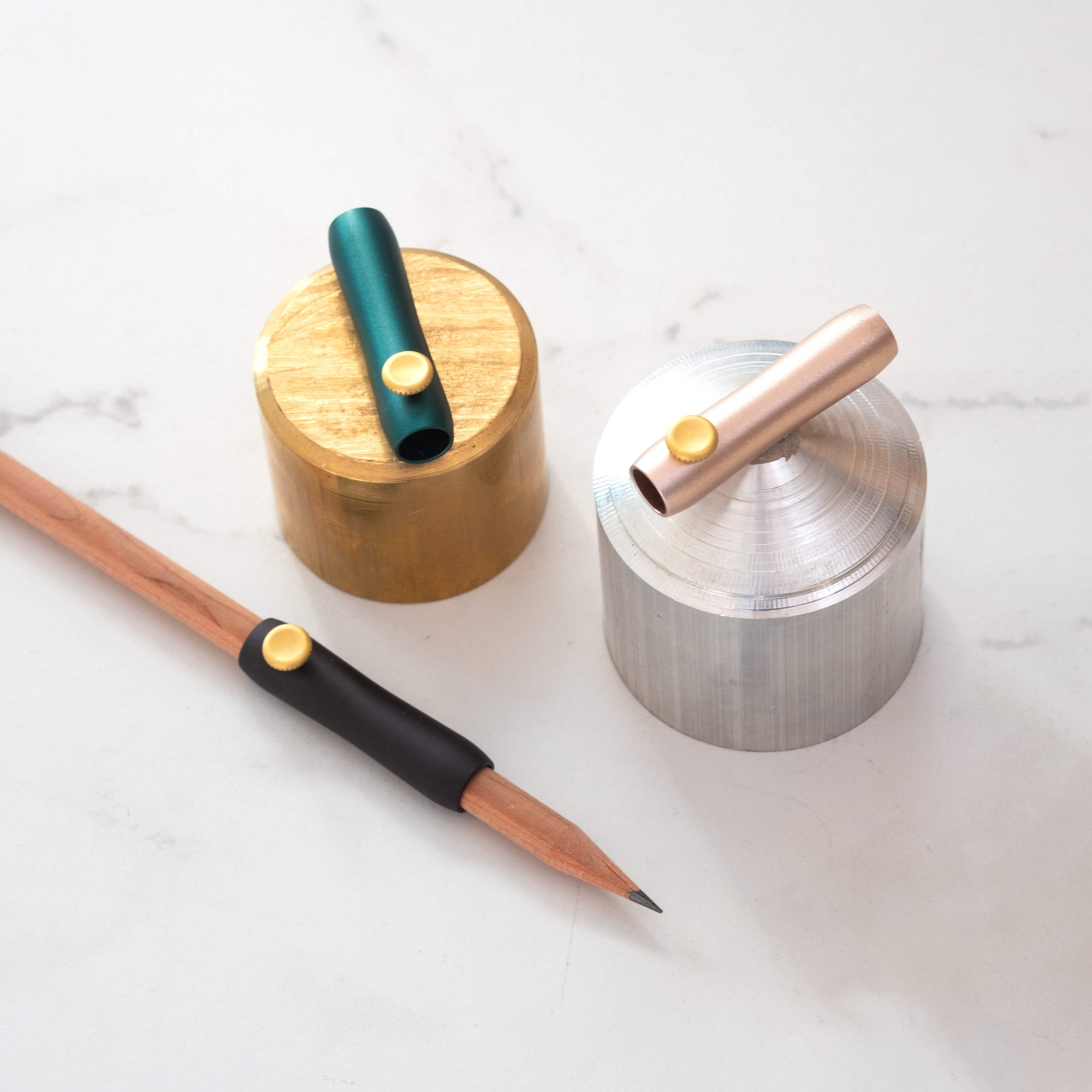 The Poise Pencil Grip Extender in (left to right) Black, Ivy and Blush.