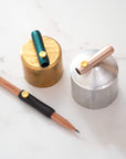 The Poise Pencil Grip Extender in (left to right) Black, Ivy and Blush.