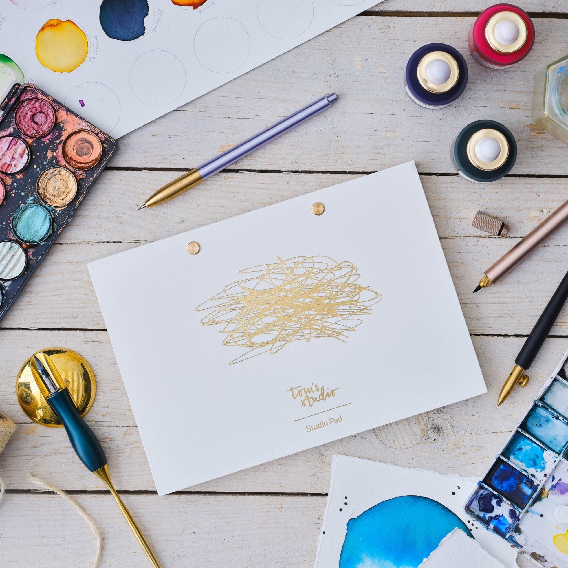 The Studio Pad refillable, customisable notebook and organiser on an artist's desk