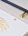 Detail shot of the solid brass studs in use in the Studio Pad refillable, customisable notebook and organiser