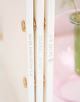A row of spines, each with a different title, all The Studio Pad refillable, customisable notebook and organiser