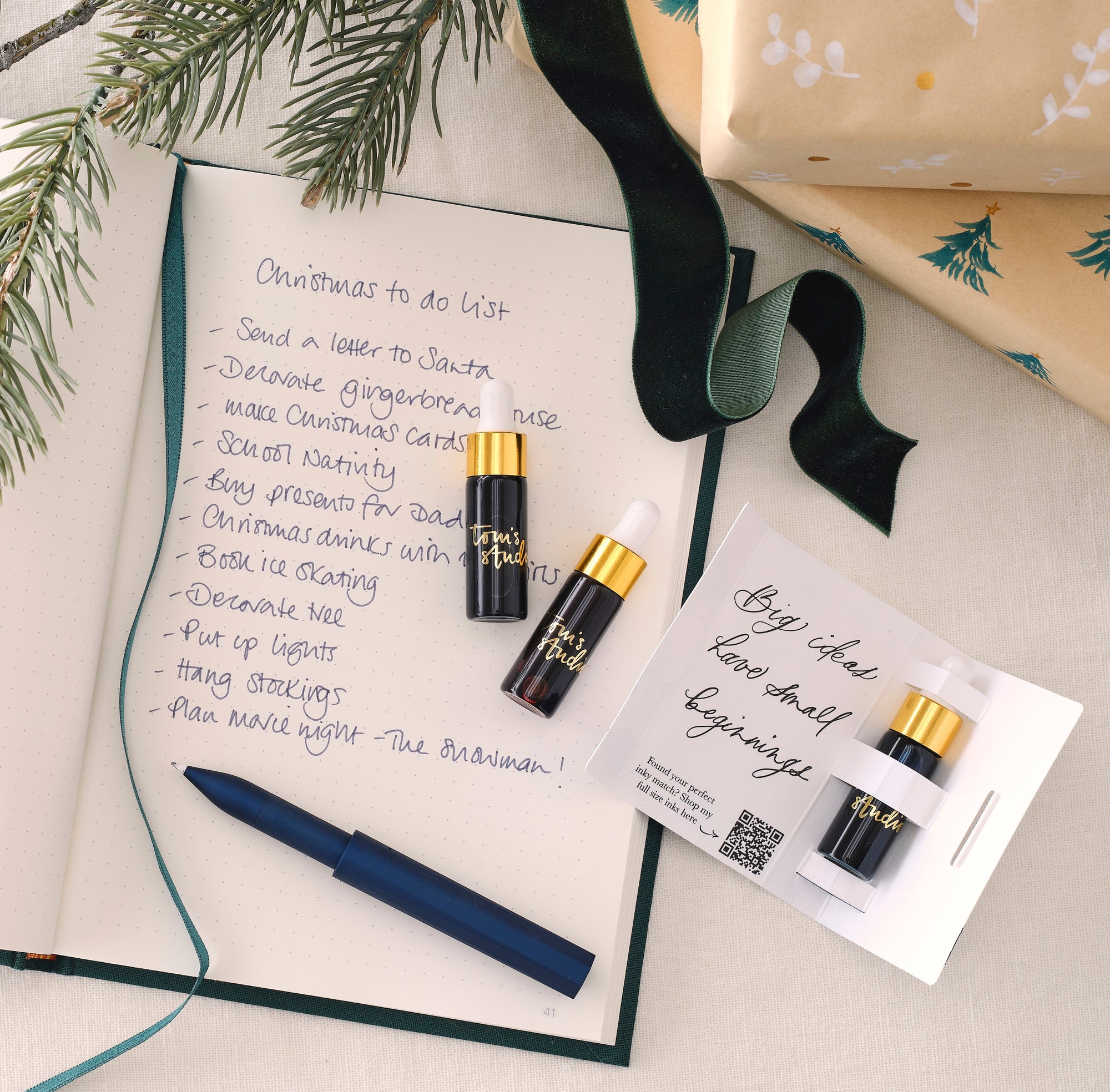 The Wren refillable writing pen in Midnight with three mini fountain pen inks and an A5 Semikolon linen bound notebook