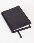 Handmade by Edward De Lacy: leather notebook / journal in black. Closed cover.