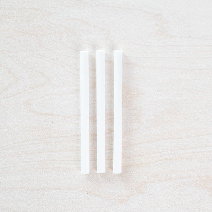 3 individual spare ink reservoirs for a Lumos Single Pen displayed on a light wooden surface.