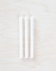 3 individual spare ink reservoirs for a Lumos Single Pen displayed on a light wooden surface.