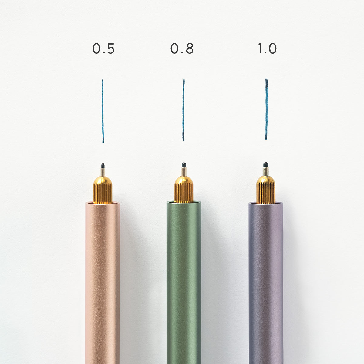 Three Lumos pens installed with three different sized fineliner tips (0.5. 0.8 & 1.0). Pen and line of tip annotated to show size and displayed on a white background.