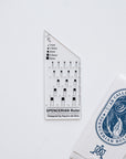 The Spencerian calligraphy ruler by Aquino da Silva shown with packaging