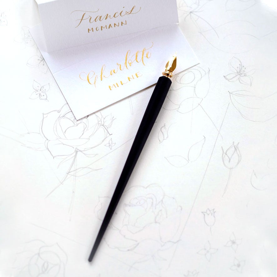 The Original Flourish Straight Calligraphy Pen in Black shown with calligraphy/hand lettered place cards