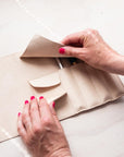 Removing a refillable fineliner from the Leather Pen Roll handmade by Edward de Lacy