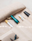 A close up of the pen holder section of the Leather Pen Roll, handmade by Edward de Lacy