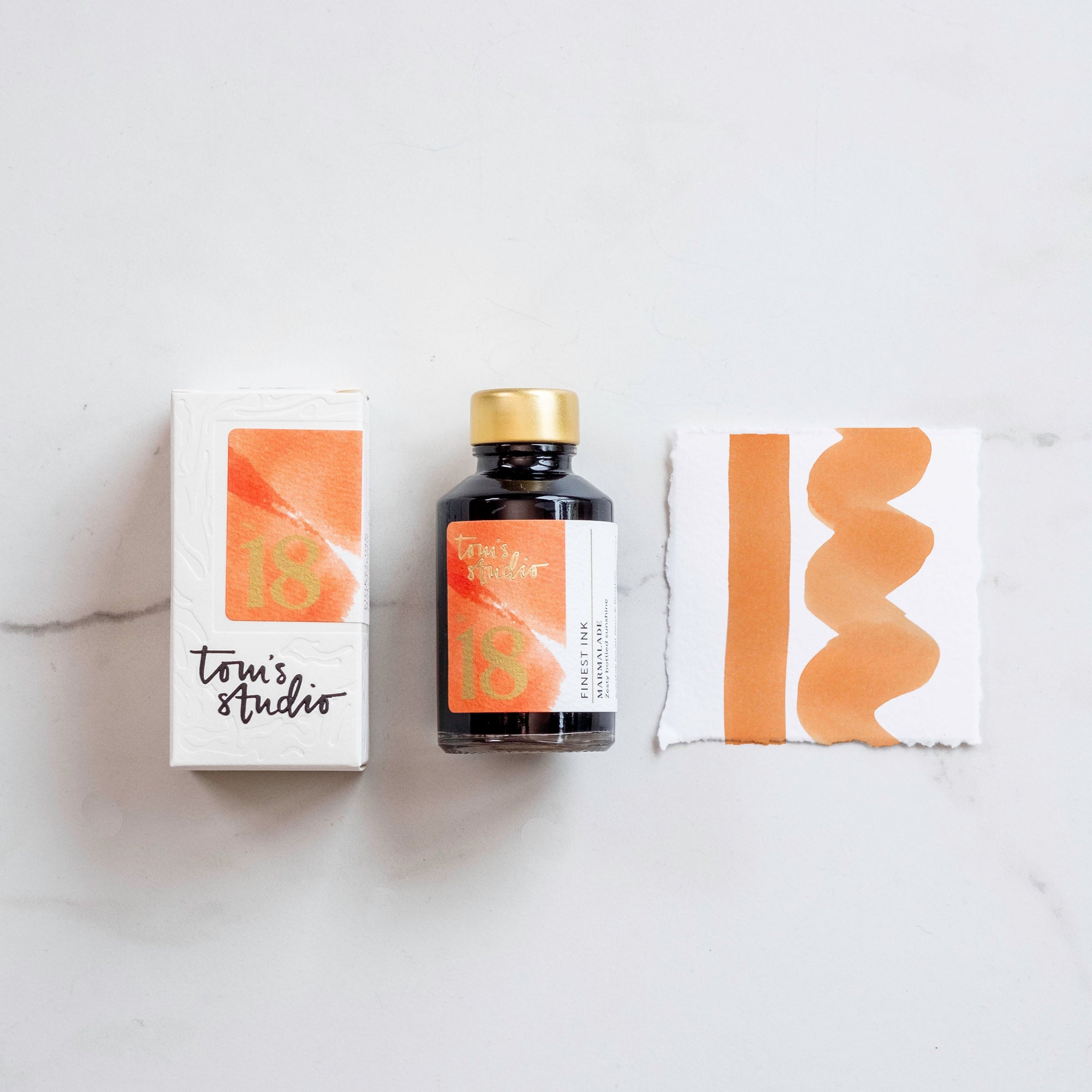 Tom's Studio Marmalade Fountain Pen Ink – featuring the packaging, bottle and a swatch on paper