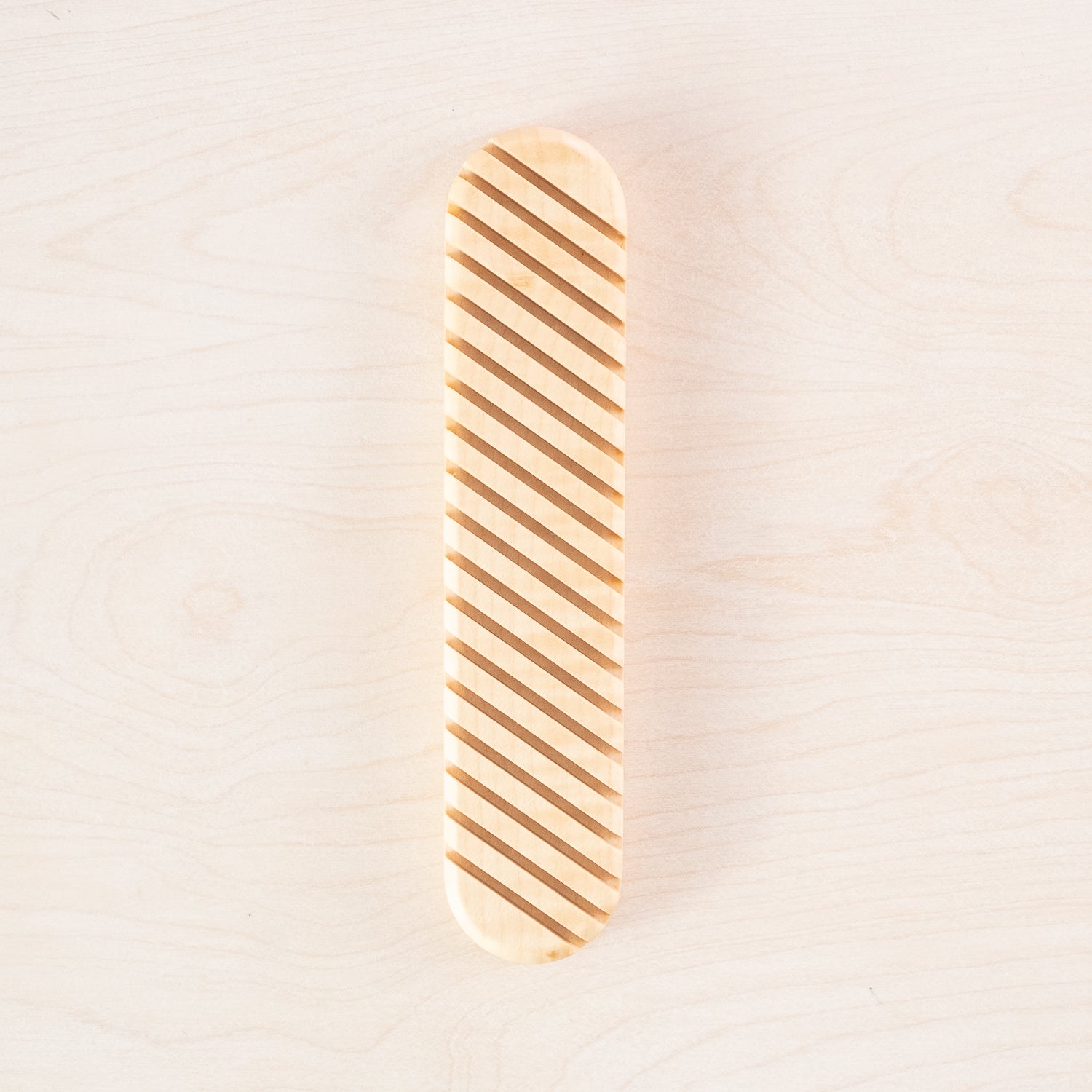 A direct overhead shot of the Envelope Rack crafted from beautiful British sycamore, made by Keiyosa