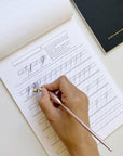 A sample page from the Copperplate Practice Pad by Logos Calligraphy in use - Lowercase Letters