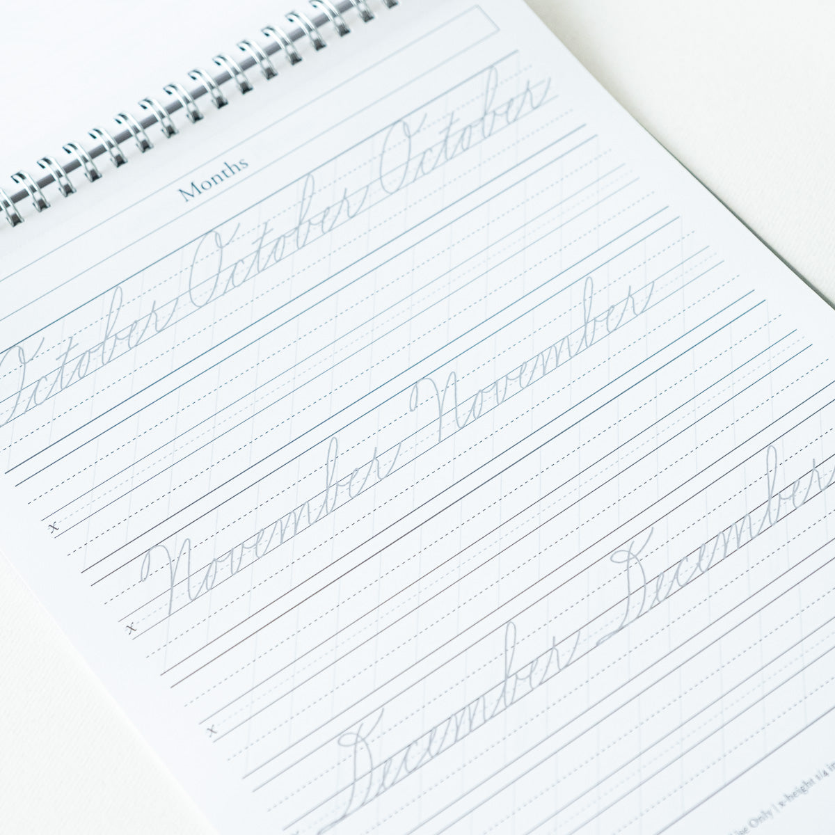 A sample page from the Cursive Practice Workbook by Logos Calligraphy