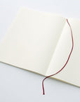 The MD Notebook Sketcbook - open on a table with marker ribbon