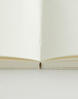 The MD Notebook Sketchbook spine open to show flat-laying pages