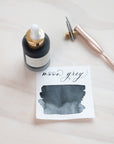 Moon Grey - Calligraphy Ink in bottle with swatch showing the ink colour