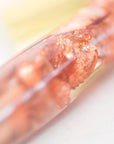 Rose gold flecks in the grip of a hand made oblique calligraphy pen