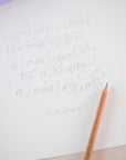 Cursive writing in pencil on cartridge paper with a scented pencil