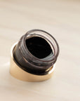 Tilt Solid Brass Ink Pot Holder with clear acrylic ink pot – shown filled with calligraphy ink