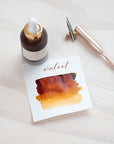 Walnut - Calligraphy Ink in bottle with swatch showing the ink colour