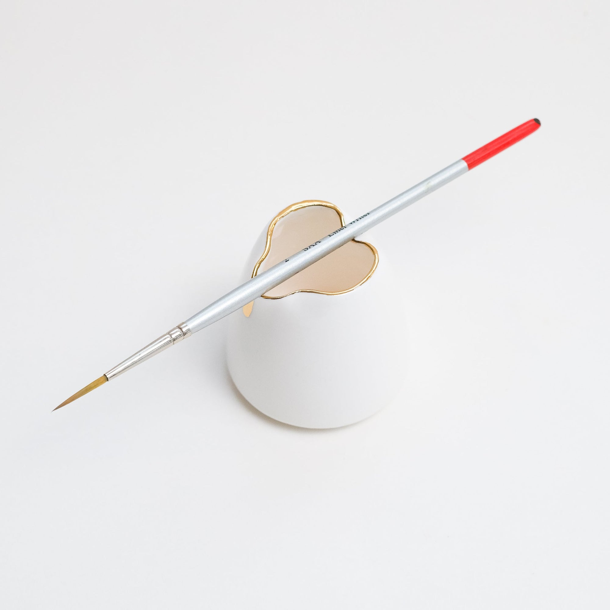 Fine Bone China Artist's Water Jug by Wendy Tournay with paintbrush balanced on top