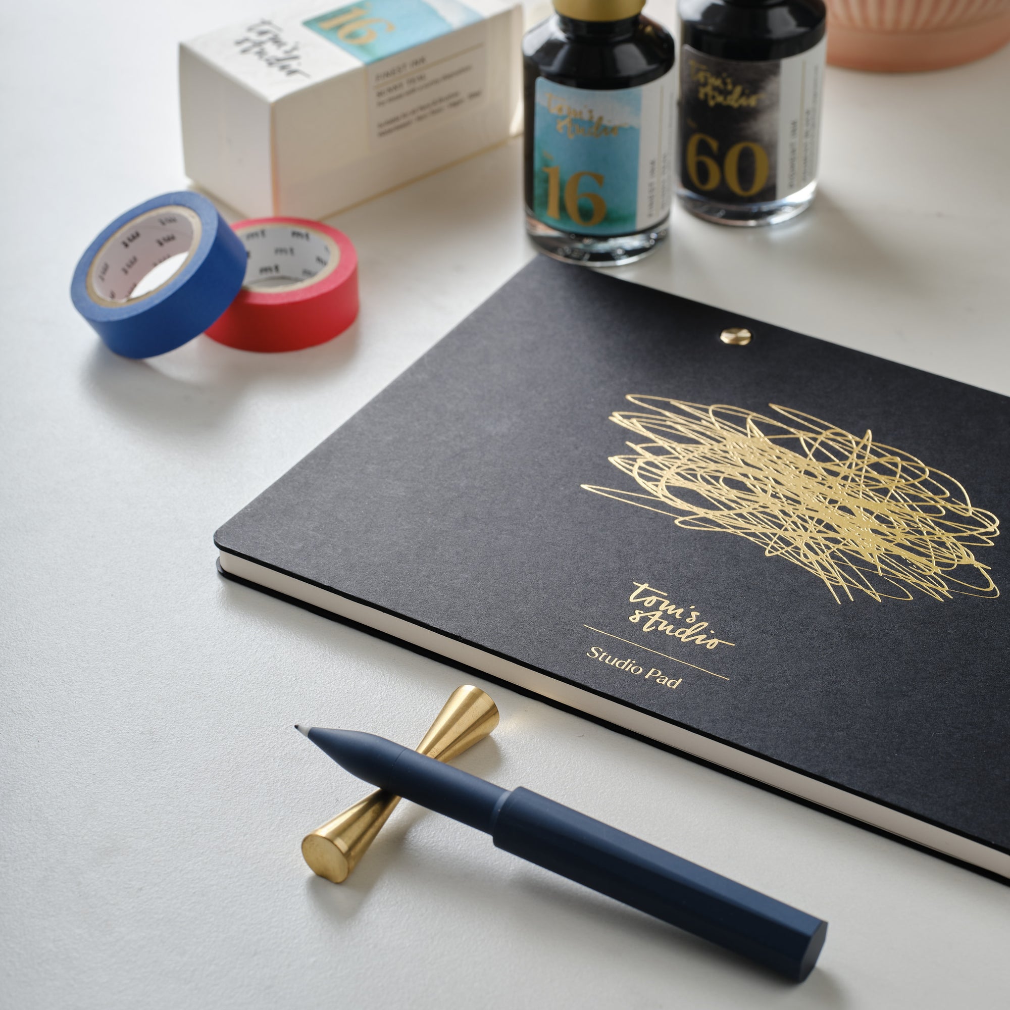 The Studio Pad in Black – a refillable, customisable notebook and organiser on a desk setup with the Wren refillable writing pen