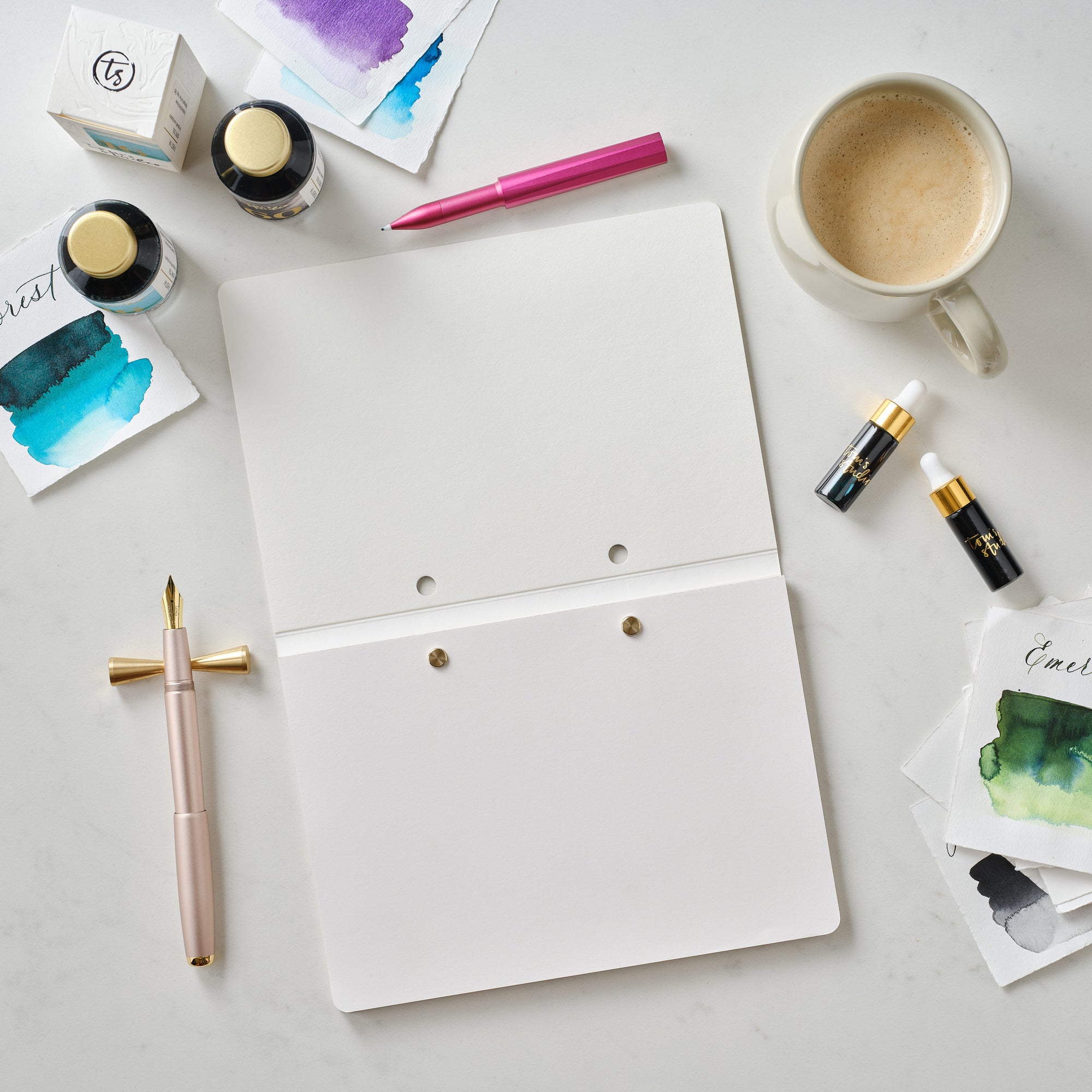 The Studio Pad in White – a refillable, customisable notebook and organiser laid open on a desk setup